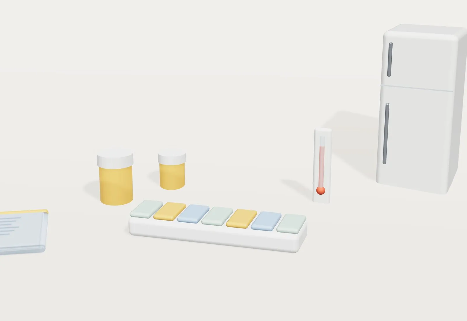 Un pastillero semanal de colores junto a botes de pastillas, un termómetro, una funda de documentos y una pequeña nevera al fondo.